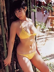 Incredible asian babe in a bikini shows off her big plump boobs